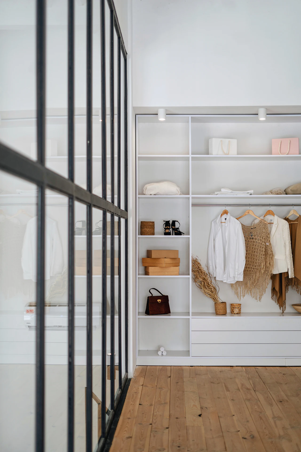 Walk-in closet with white shelving