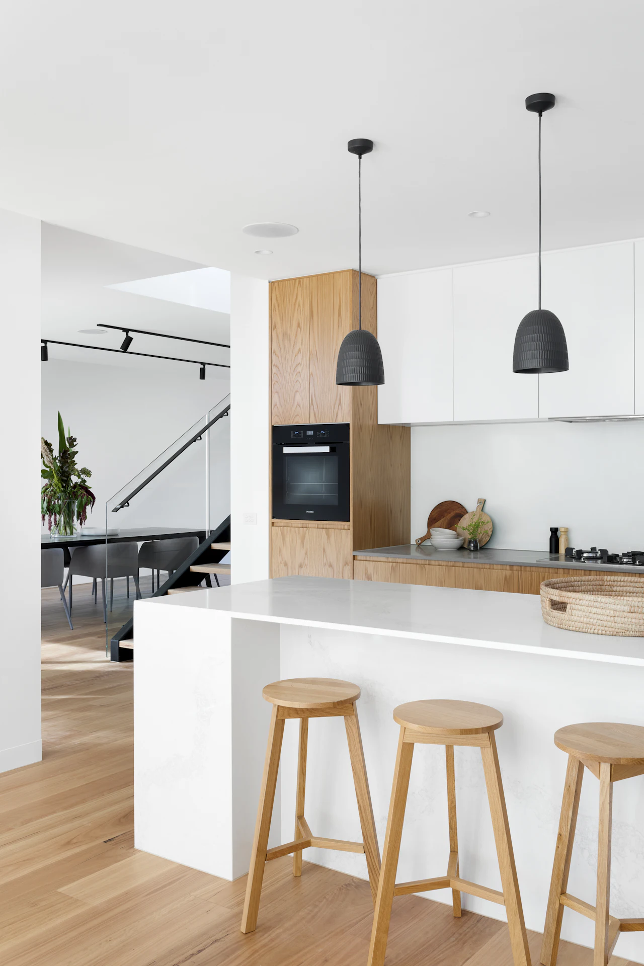 Tall oak cabinetry with integrated oven