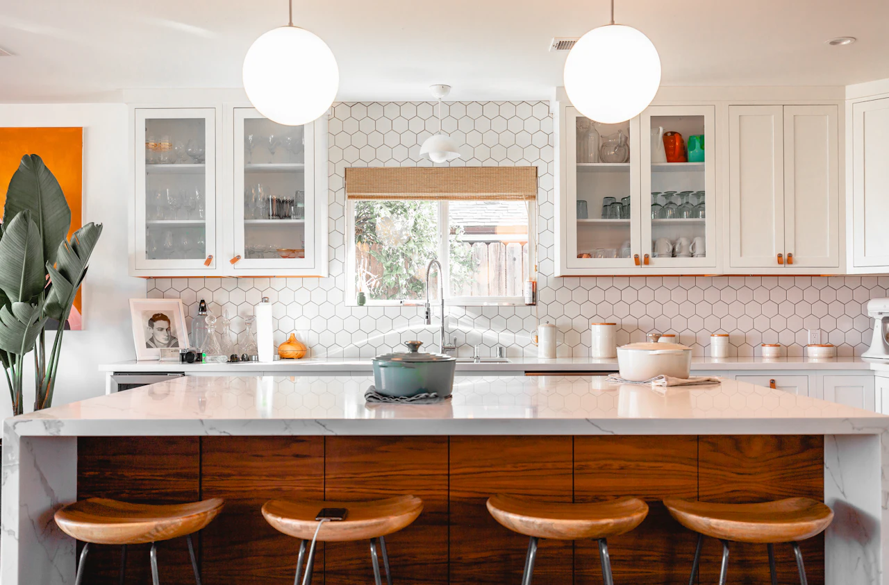 White kitchen with a walnut island