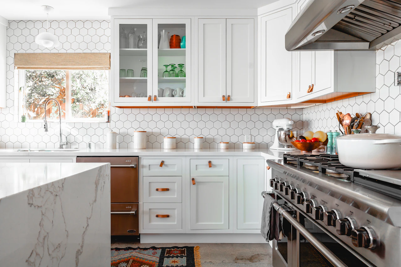 Kitchen island with a veined stone waterfall edge
