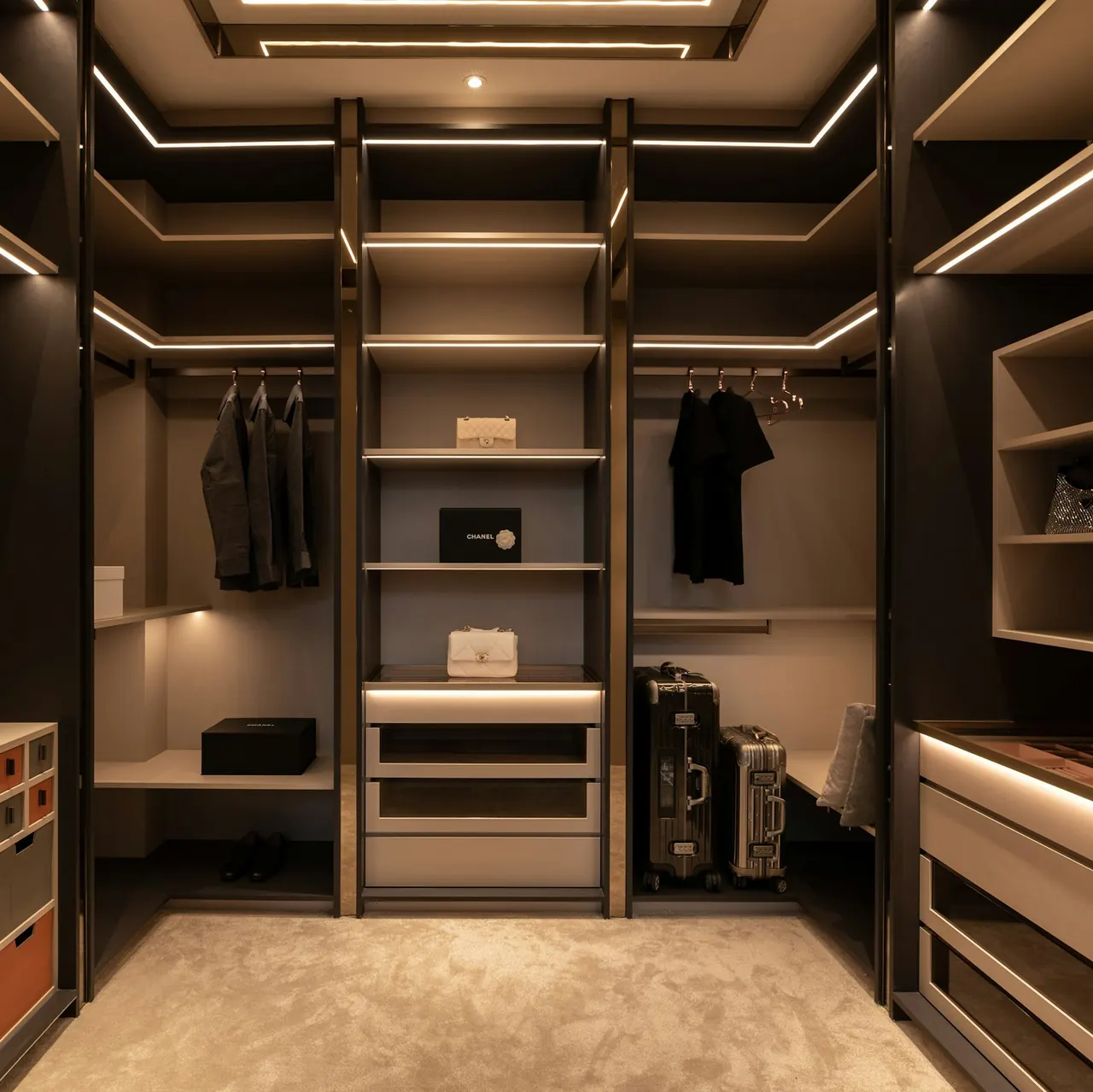 Walk-in closet in dark wood with integrated lighting