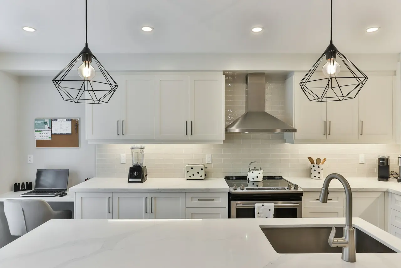 Kitchen with white veined countertops