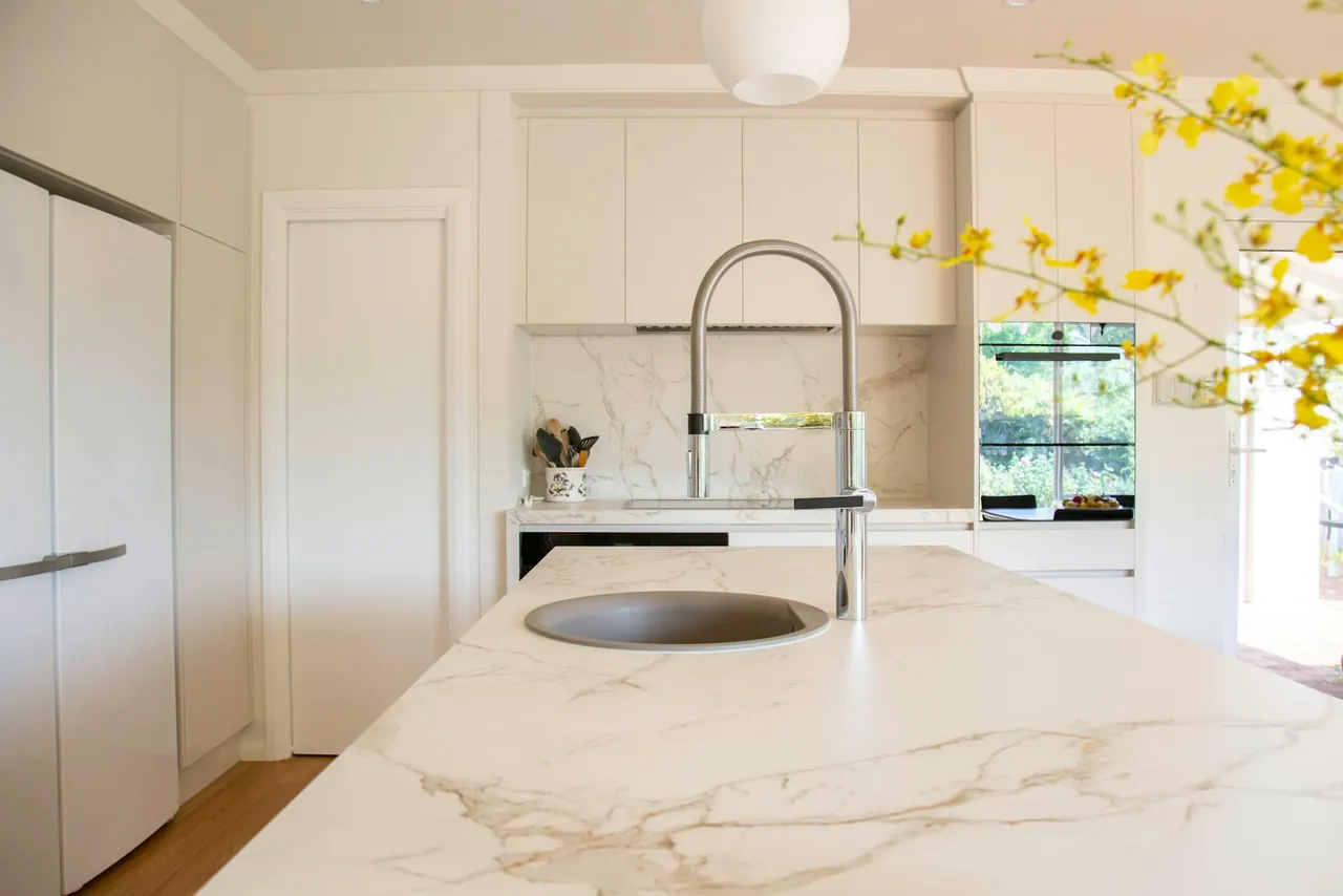 Kitchen island with a gold-veined stone countertop