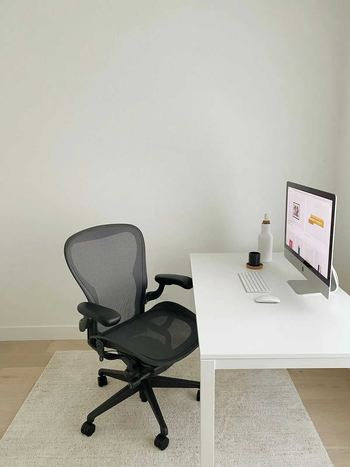 Minimal home office with a white desk