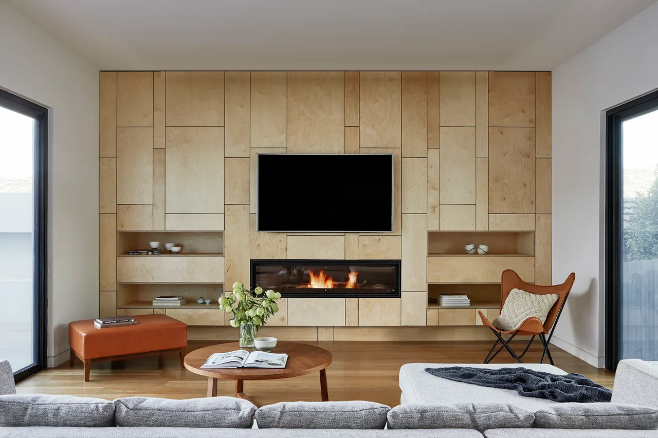 Oak paneled media wall with fireplace
